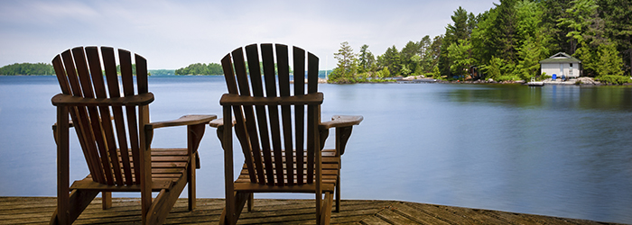 Chairs on a lakeside dock.