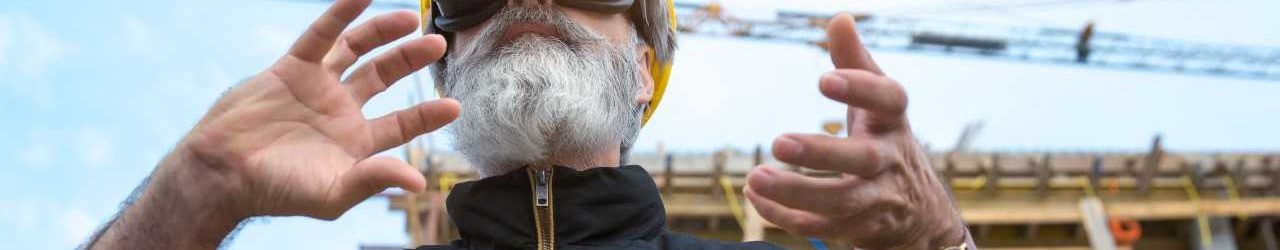 man with VR headset on construction site.