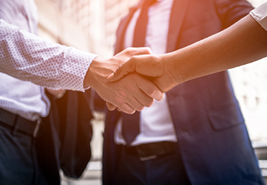 Business people shaking hands.
