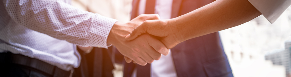 Business people shaking hands.
