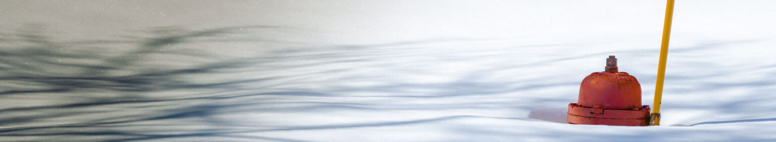 Fire hydrant poking out of deep snow